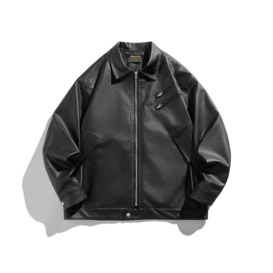 Black faux leather jacket flat lay, front view, with collar, center zip, diagonal chest zip pockets and snap cuffs