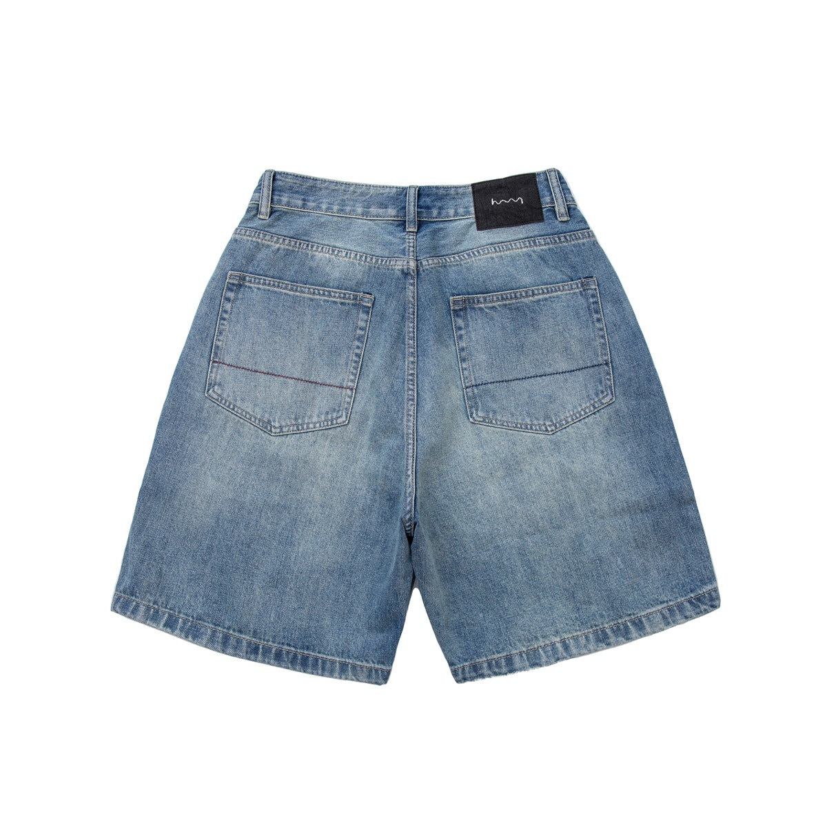 Back view of light blue denim shorts laid flat, with two pockets and a black waistband patch.