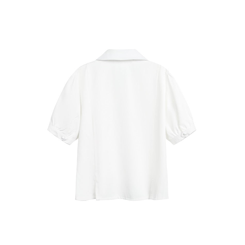 Back view of a white short-sleeve collared shirt with gathered sleeve cuffs and small buttons.