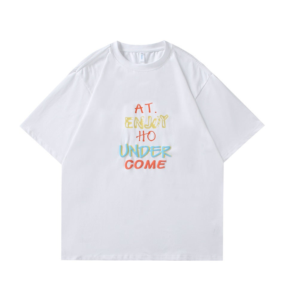 White short-sleeve crew-neck T-shirt with multicolor graffiti-style text print on the front, flat lay