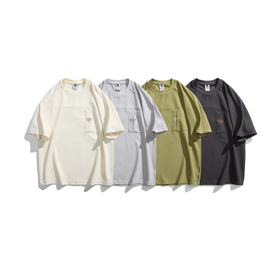 Four short-sleeve pocket T-shirts shown together in cream, light gray, olive green, and charcoal.