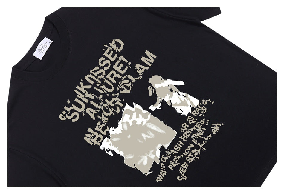 Black T-shirt laid flat with a large distressed beige-and-white graphic and lettering on the front.