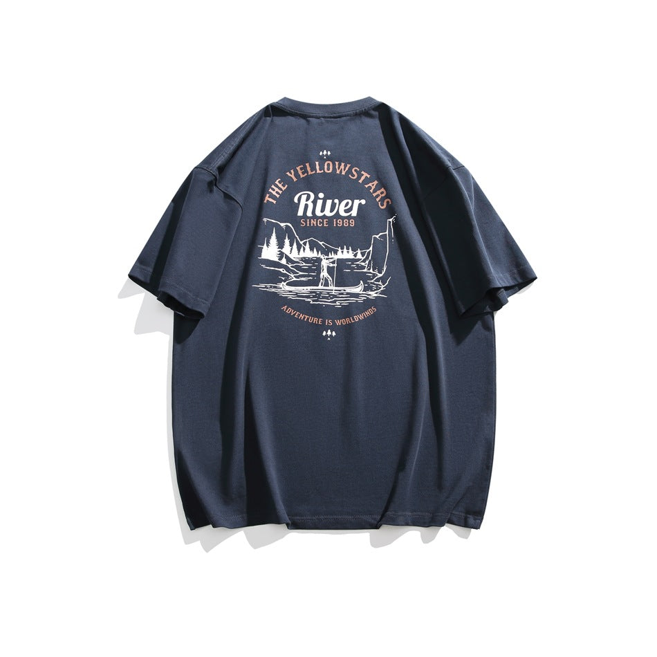 Back of a navy T-shirt with a large Yellowstone River landscape graphic in cream and muted peach.