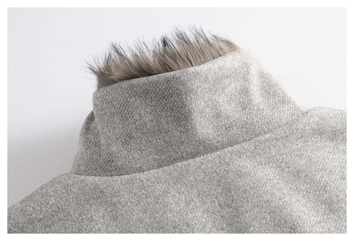 Close-up of a gray high collar edged with dark furry trim.