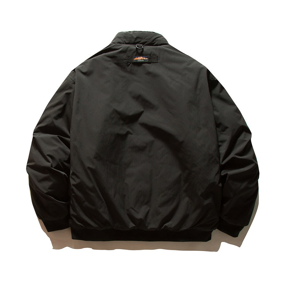 Black padded-look bomber jacket back view with small patch label at the neck, ribbed cuffs and hem