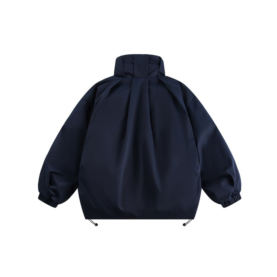 Back view of a navy jacket with a tall collar, roomy sleeves, elastic cuffs and adjustable hem cords.
