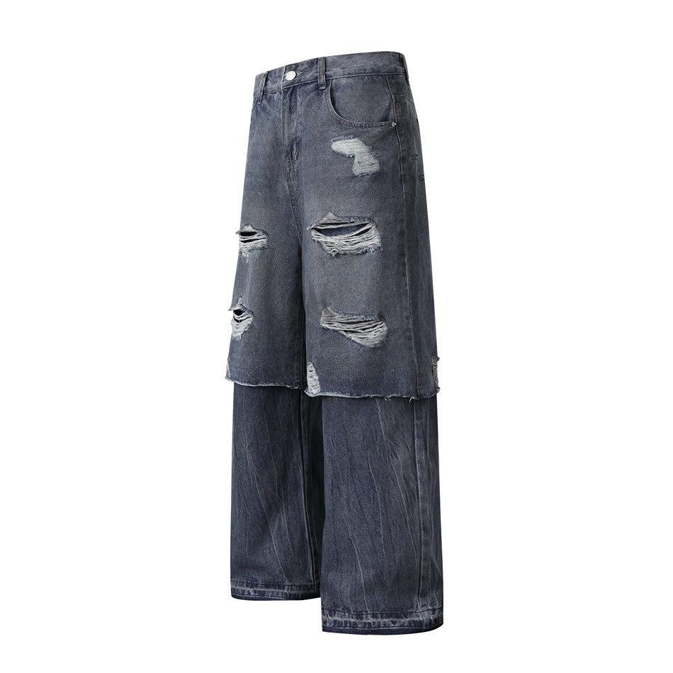 Dark blue distressed layered wide-leg jeans shown at a three-quarter angle with ripped overlay