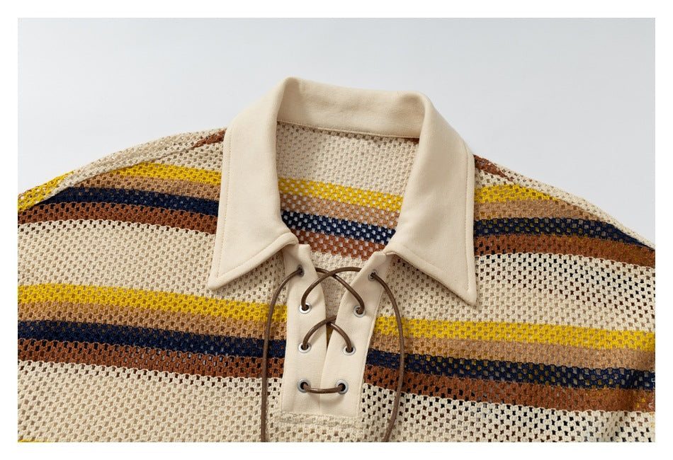 Close view of the cream pointed collar, striped open-knit fabric and brown lace-up neckline.