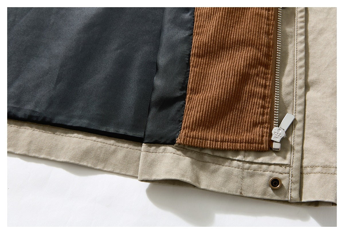 Close-up of a beige jacket hem and zipper, showing black lining and a brown corduroy panel.