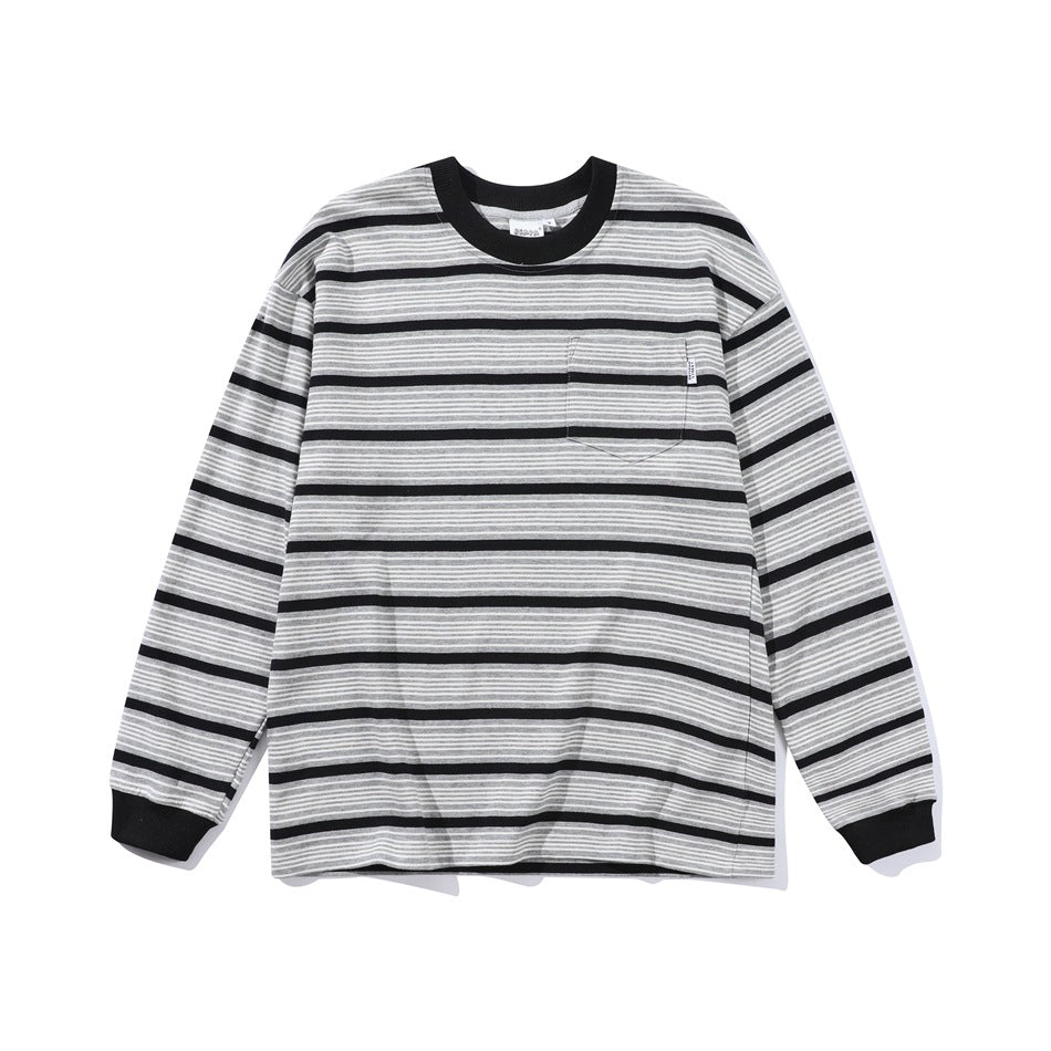 Gray long-sleeve striped crew-neck top with black stripes, black collar and cuffs, and chest pocket, flat lay front