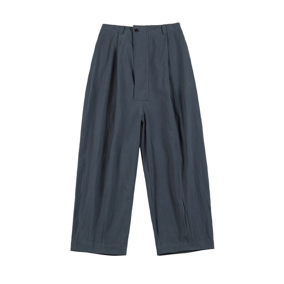 Blue wide-leg pleated trousers, flat lay front view with button closure and belt loops