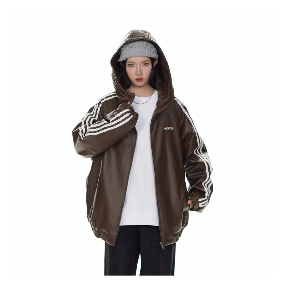 Model wearing an open brown hooded leather-look jacket with the hood up over a white top and dark pants