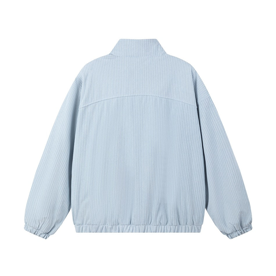 Back view of a light blue pinstriped jacket with a stand collar and elasticated cuffs and hem.