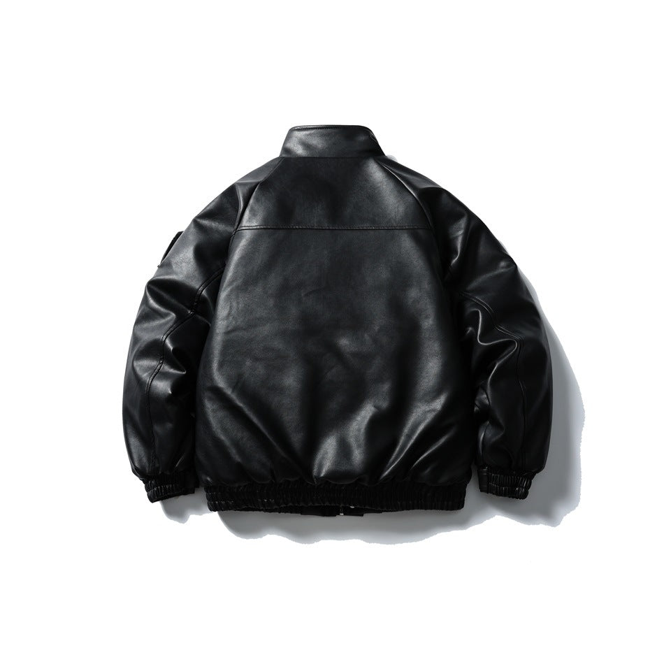 Back view of black faux-leather jacket with stand collar, back yoke seam, raglan sleeves and elastic hem