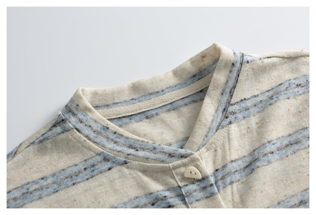 Close-up of the striped top's neckline, collar seam, and top button.