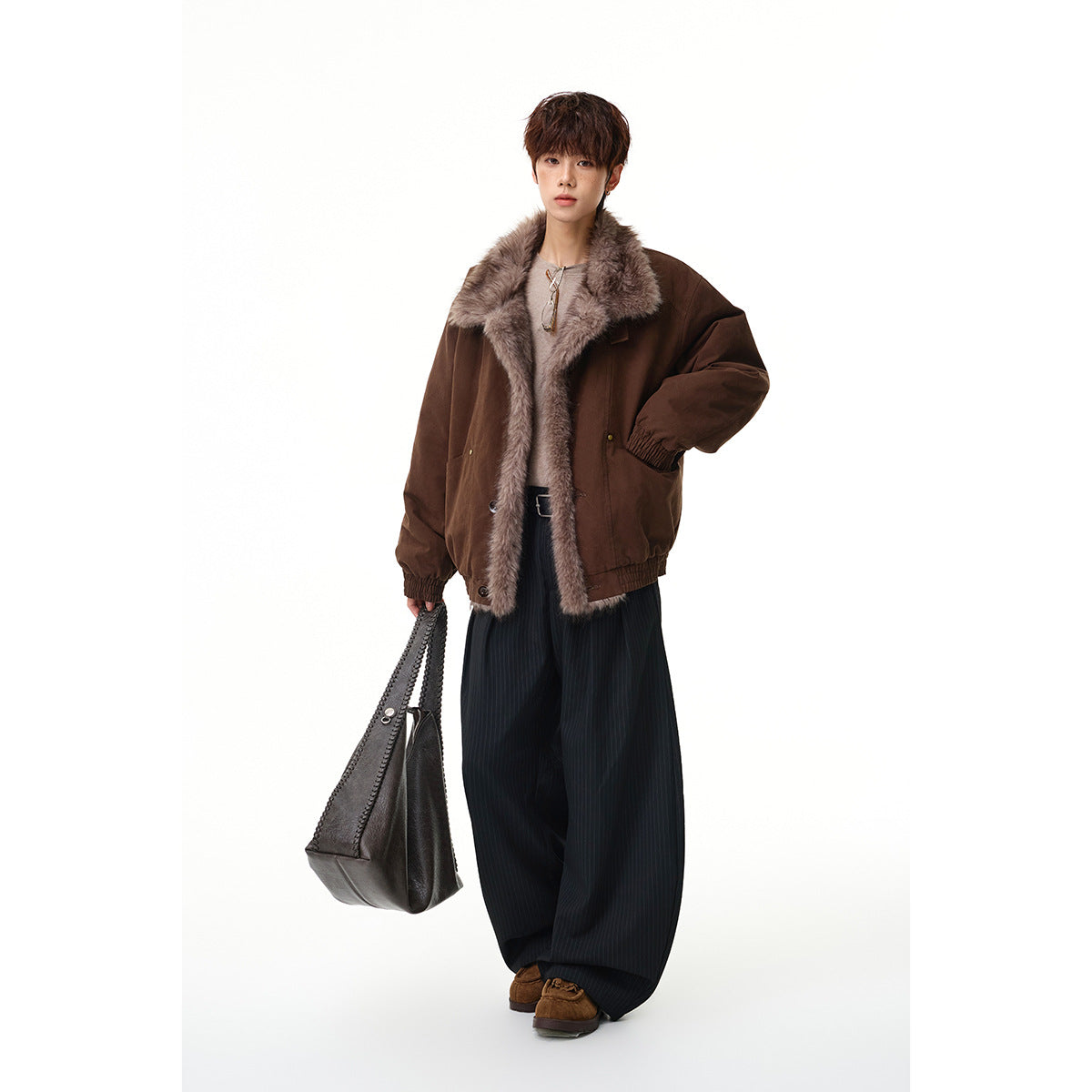 Full-length model wearing a dark brown jacket with a gray-brown faux-fur collar and front trim.