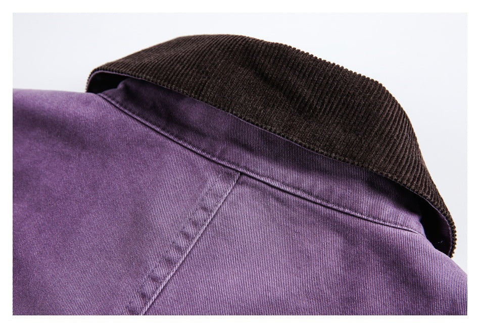 Close-up of a purple garment’s collar and seam, with a dark brown ribbed collar panel.