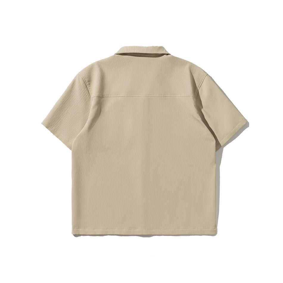 Back view of a beige ribbed short-sleeve button-up shirt.
