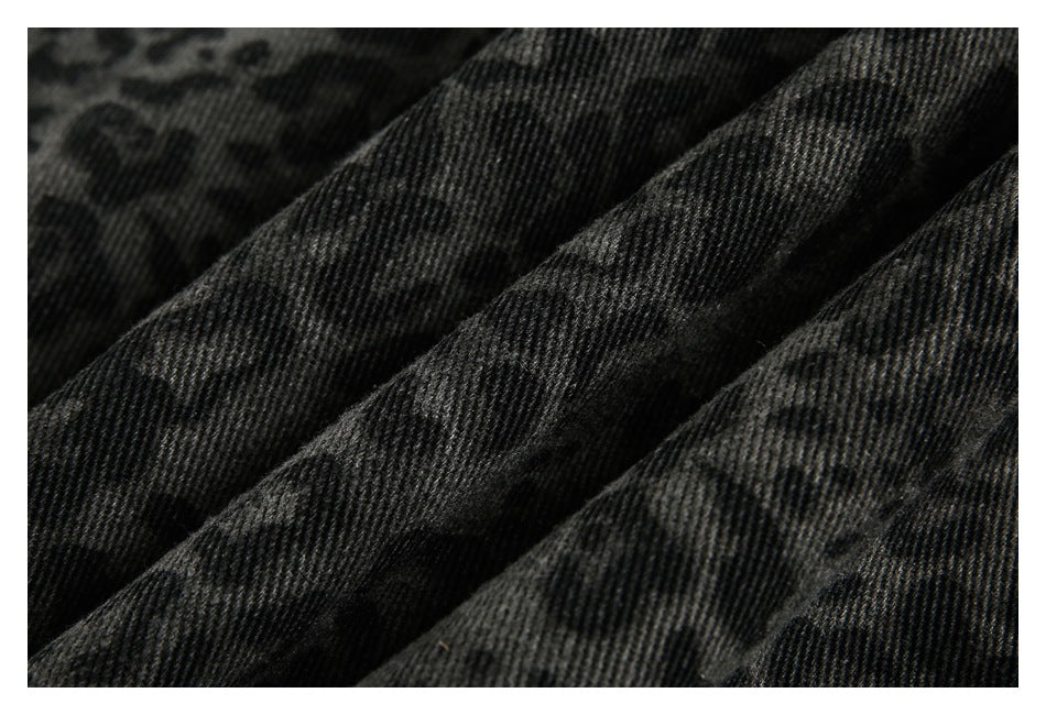 Close-up showing the ribbed texture and dark leopard pattern of charcoal fabric.