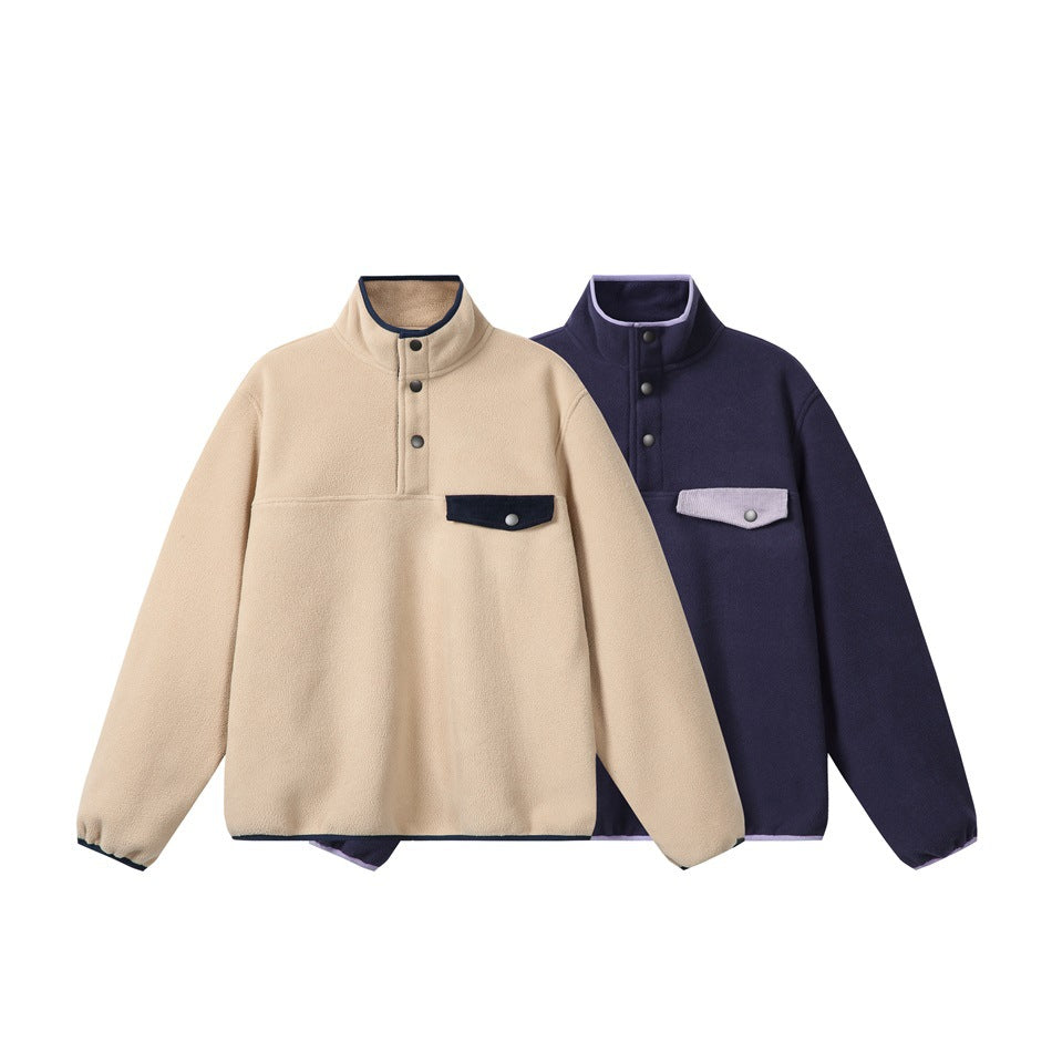 Front view of beige and dark navy fleece pullovers with stand collars, snap plackets, and contrasting chest pockets.