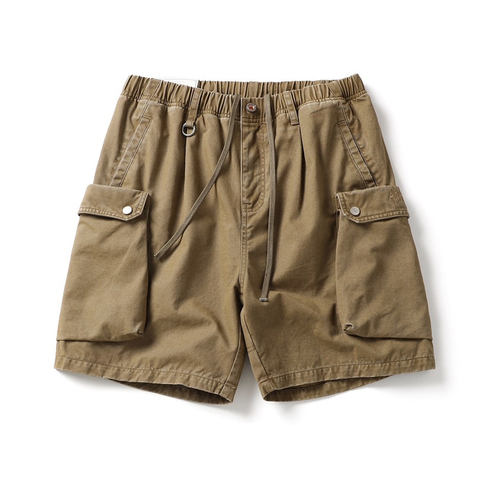 Khaki cargo shorts with elastic drawstring waist and large snap-flap cargo pockets, flat front view