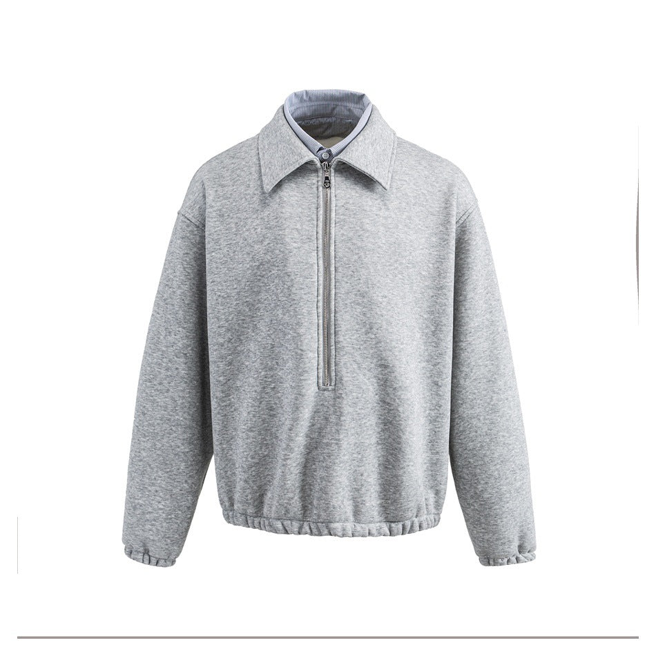 Heather gray half-zip sweatshirt with pointed collar and striped shirt layer at neck, front view on white