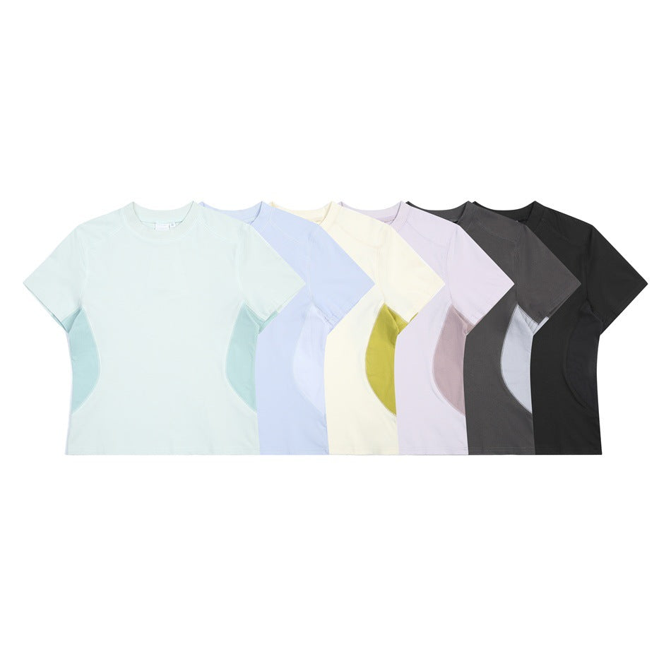 Six short-sleeve crew-neck T-shirts with curved contrast side panels in mint, blue, cream, lavender, charcoal, and black.