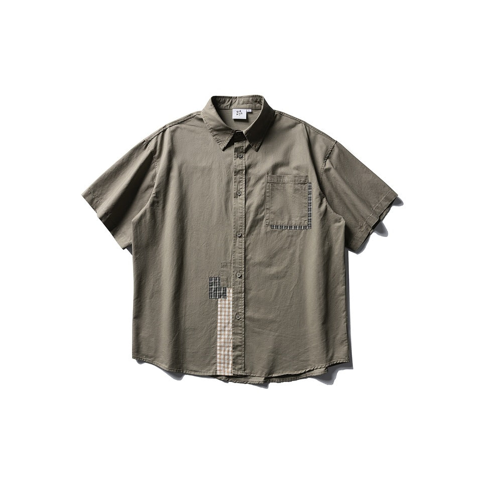 Army green short-sleeve button-up shirt with chest pocket and plaid patchwork trim, flat lay front view