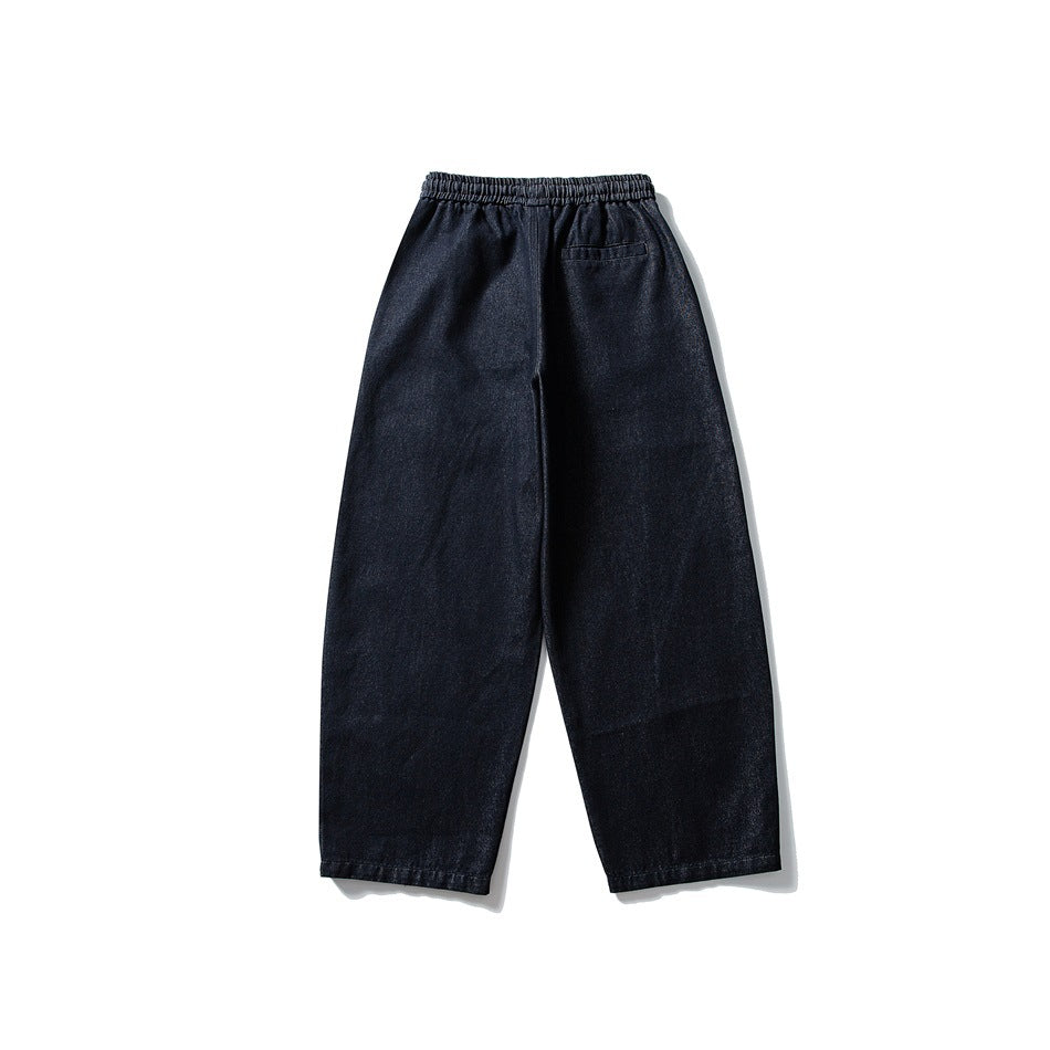 Back view of dark blue wide-leg denim pants showing elastic waistband and one back pocket