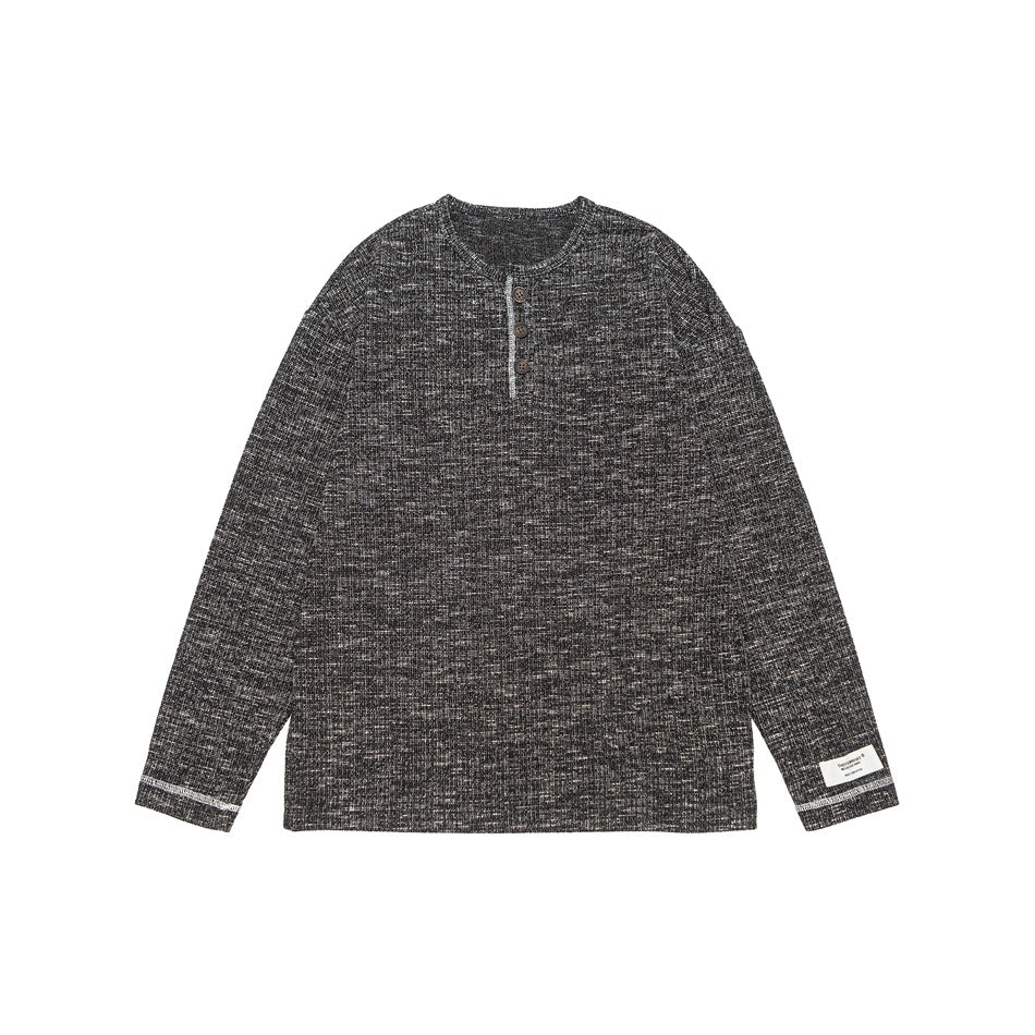 Black heathered ribbed knit long-sleeve henley top with three buttons and light contrast stitching, flat front view