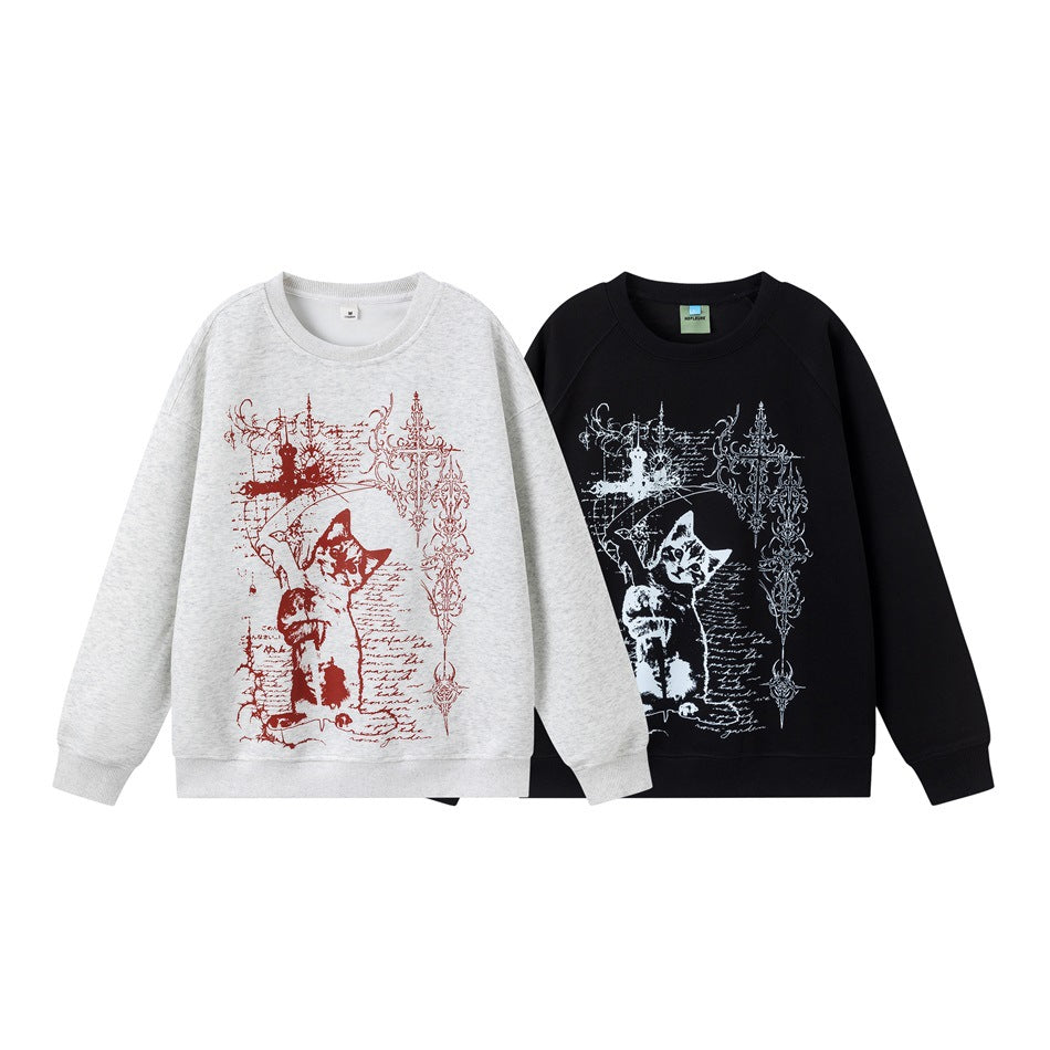 Light heather-gray and black crewneck sweatshirts shown from the front, each with a large contrasting cat illustration and