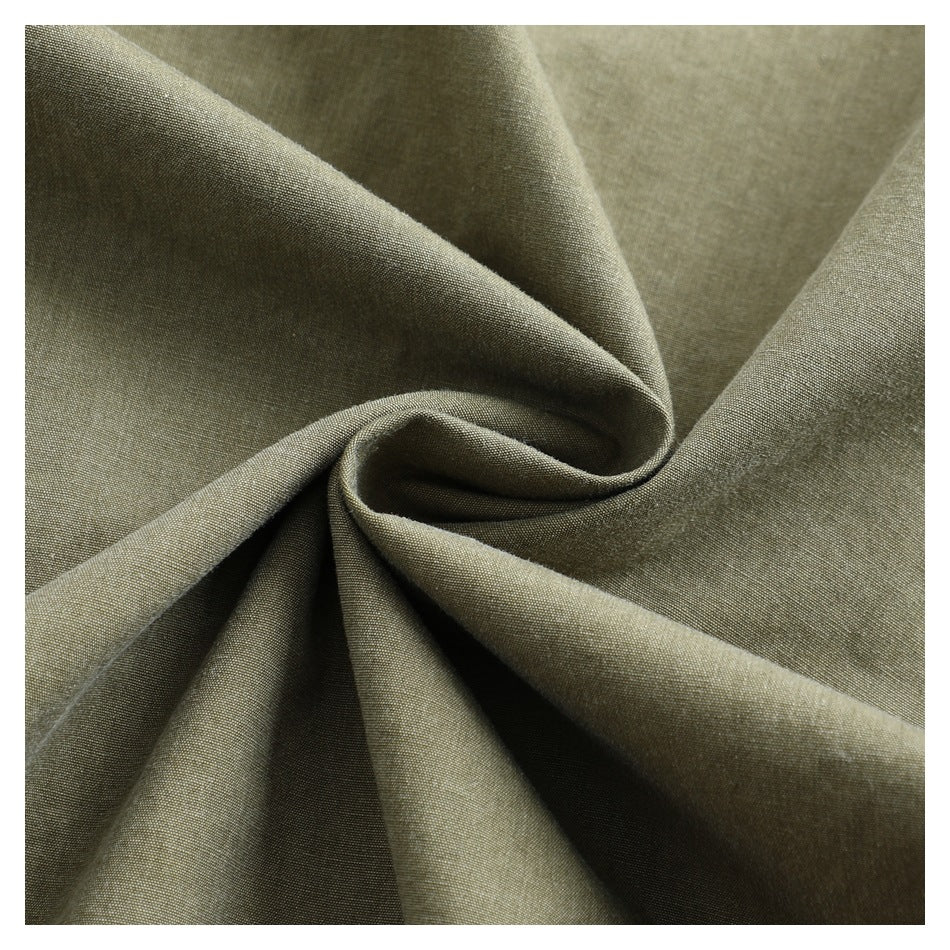 Close-up showing the olive-gray garment fabric gathered into folds.
