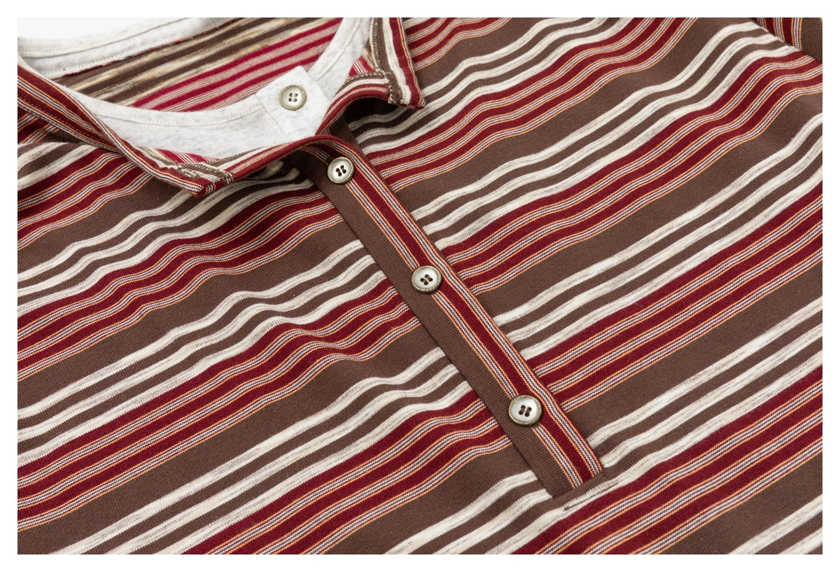 Close-up of the striped fabric and four-button placket on a brown, rust, and cream top.