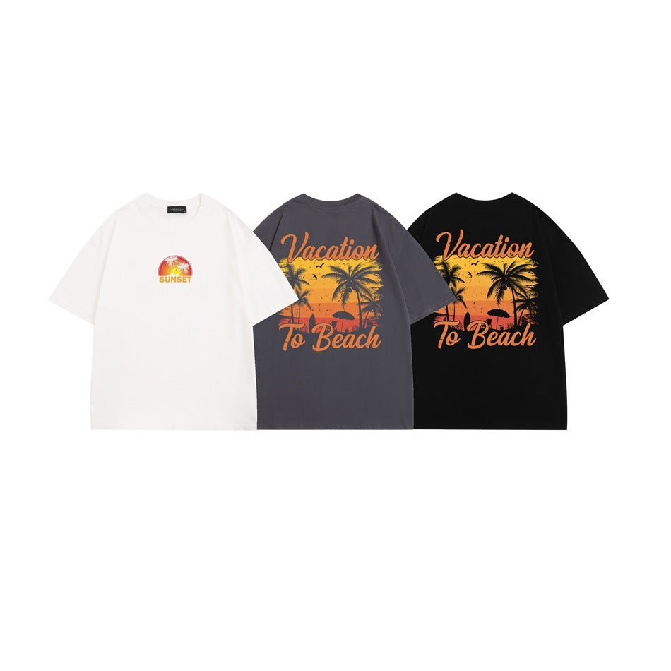 Three T-shirts in white, charcoal gray, and black; the white has a small sunset graphic, while the darker shirts show a large