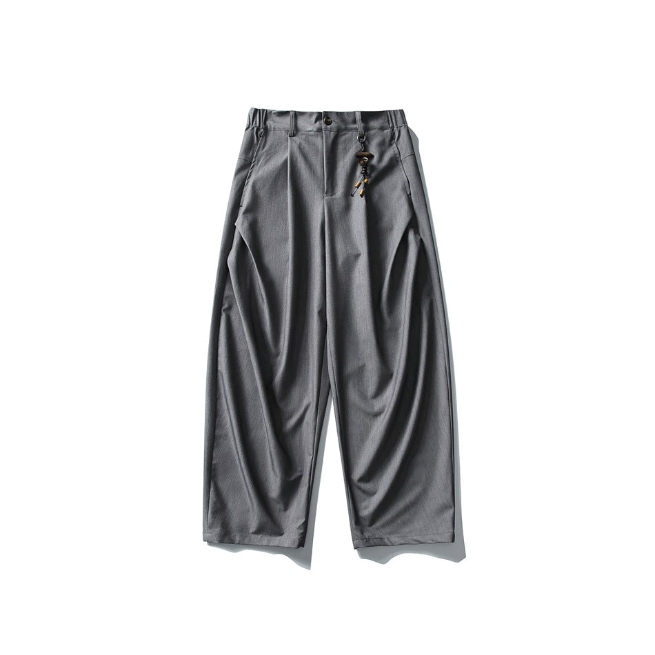 Heather gray wide-leg pleated trousers flat lay with front button and beaded charm