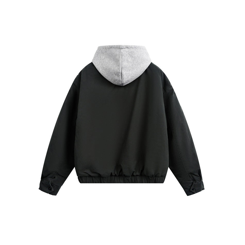 Back view of a black jacket with a gray hood and gathered hem.