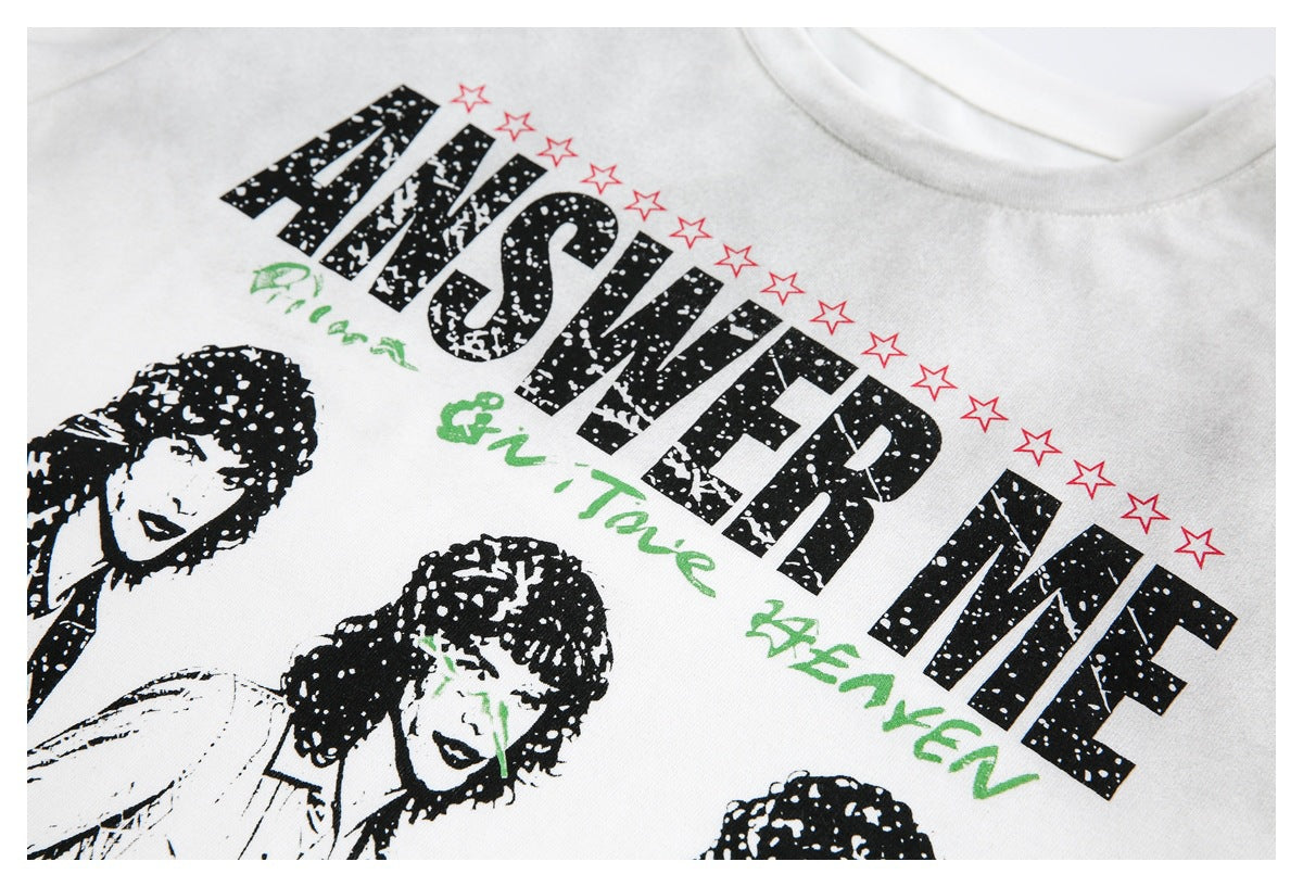 Close-up of a white T-shirt graphic with bold black lettering, red stars, green script and portrait artwork.