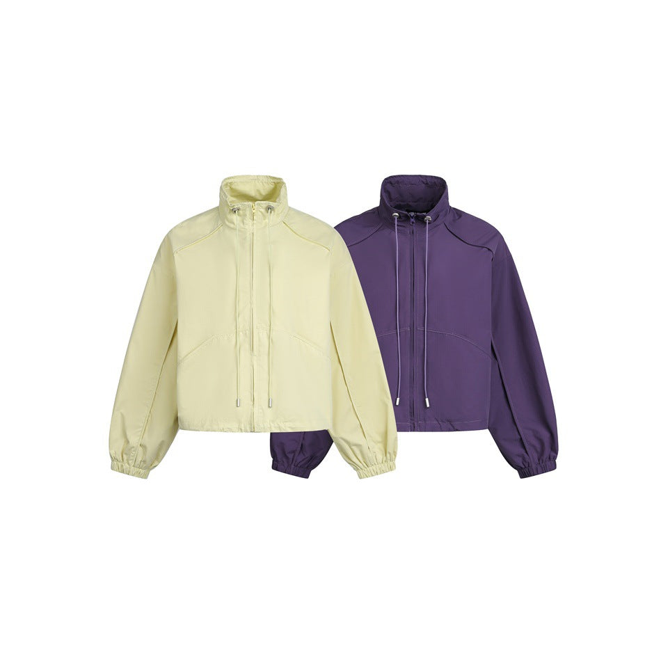Two cropped zip-front jackets with high collars and gathered cuffs, shown in pale yellow and deep purple.