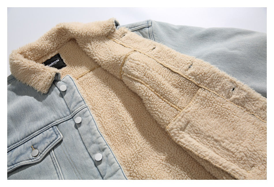 Open light blue denim jacket showing its cream fleece lining, collar, pockets, and silver snaps.