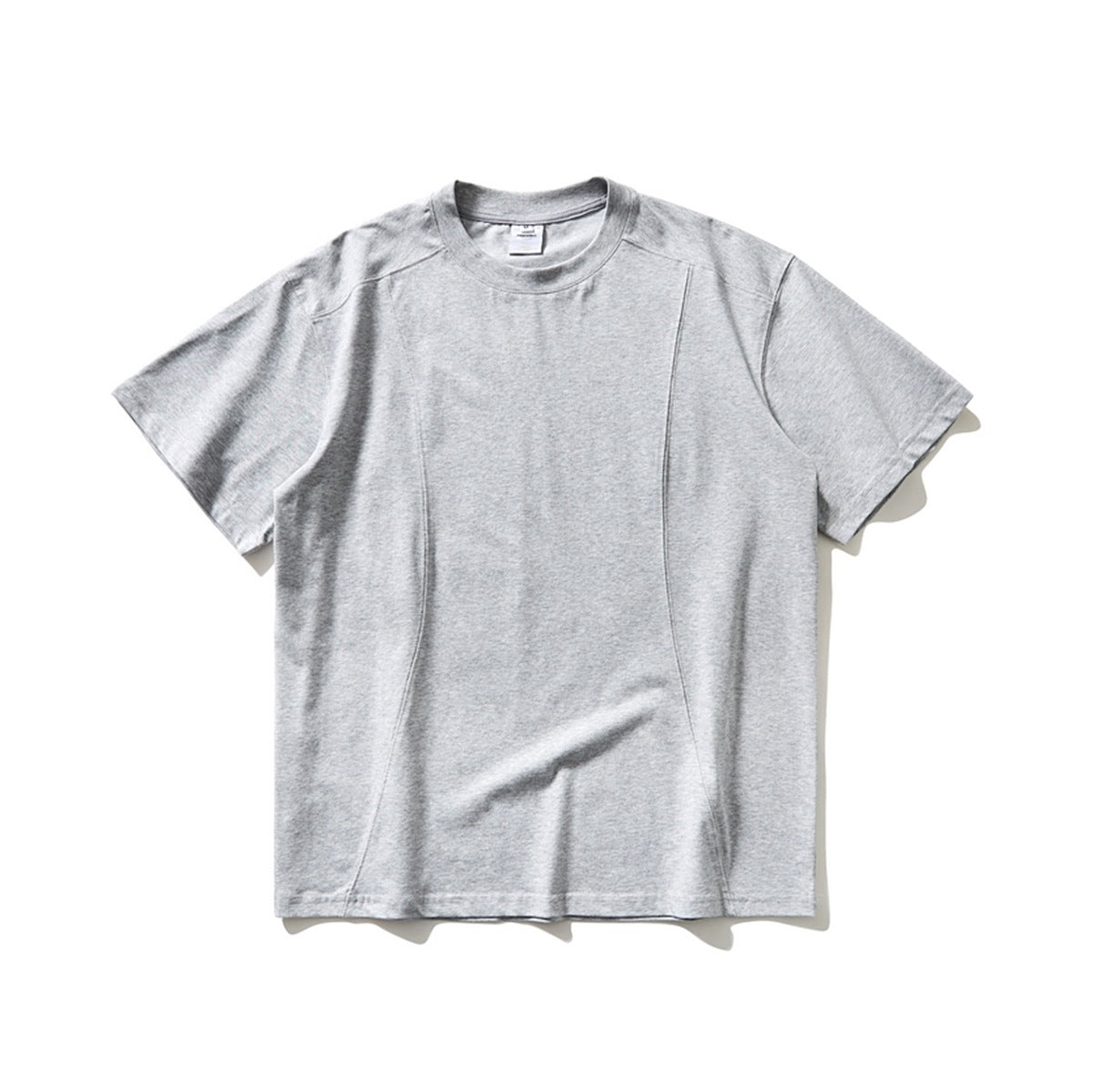 Heather gray short-sleeve crew-neck T-shirt flat lay with curved front panel seams