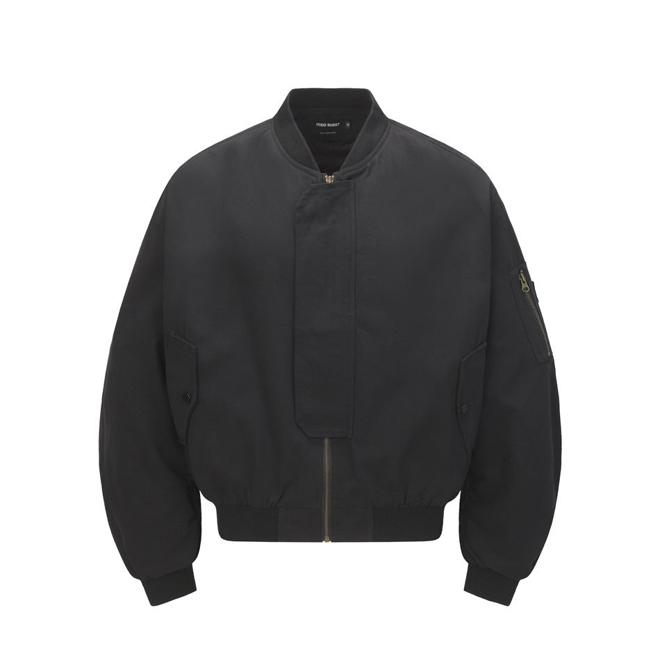 Black bomber jacket with a snap-covered front zipper, flap pockets, and a zippered sleeve pocket.