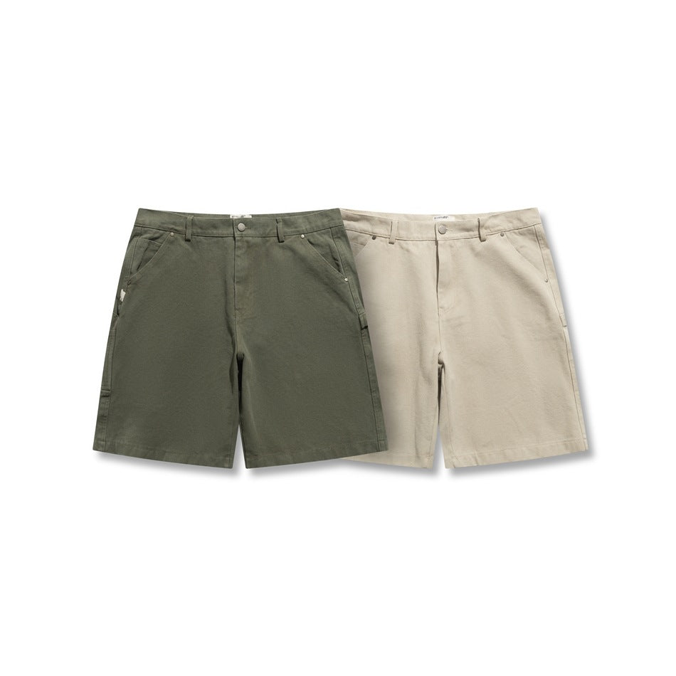 Front view of olive and light beige utility shorts displayed side by side.