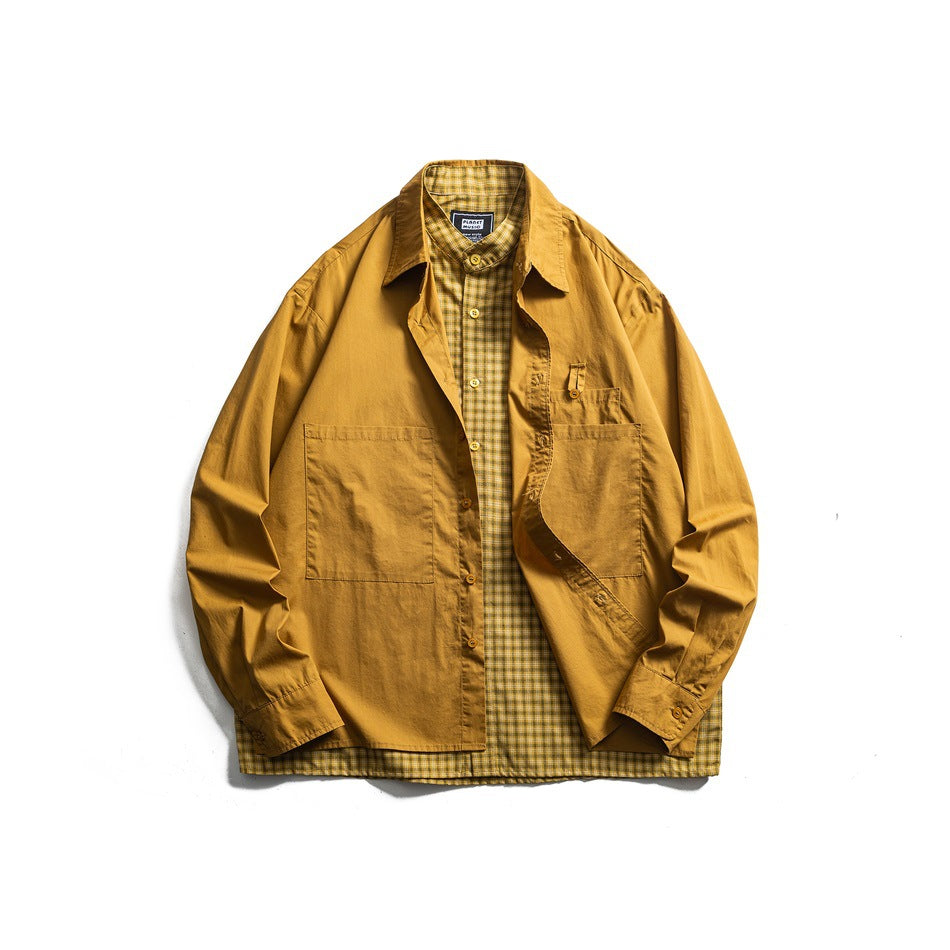 Mustard yellow shirt worn open over a matching yellow plaid under-layer, with large patch pockets