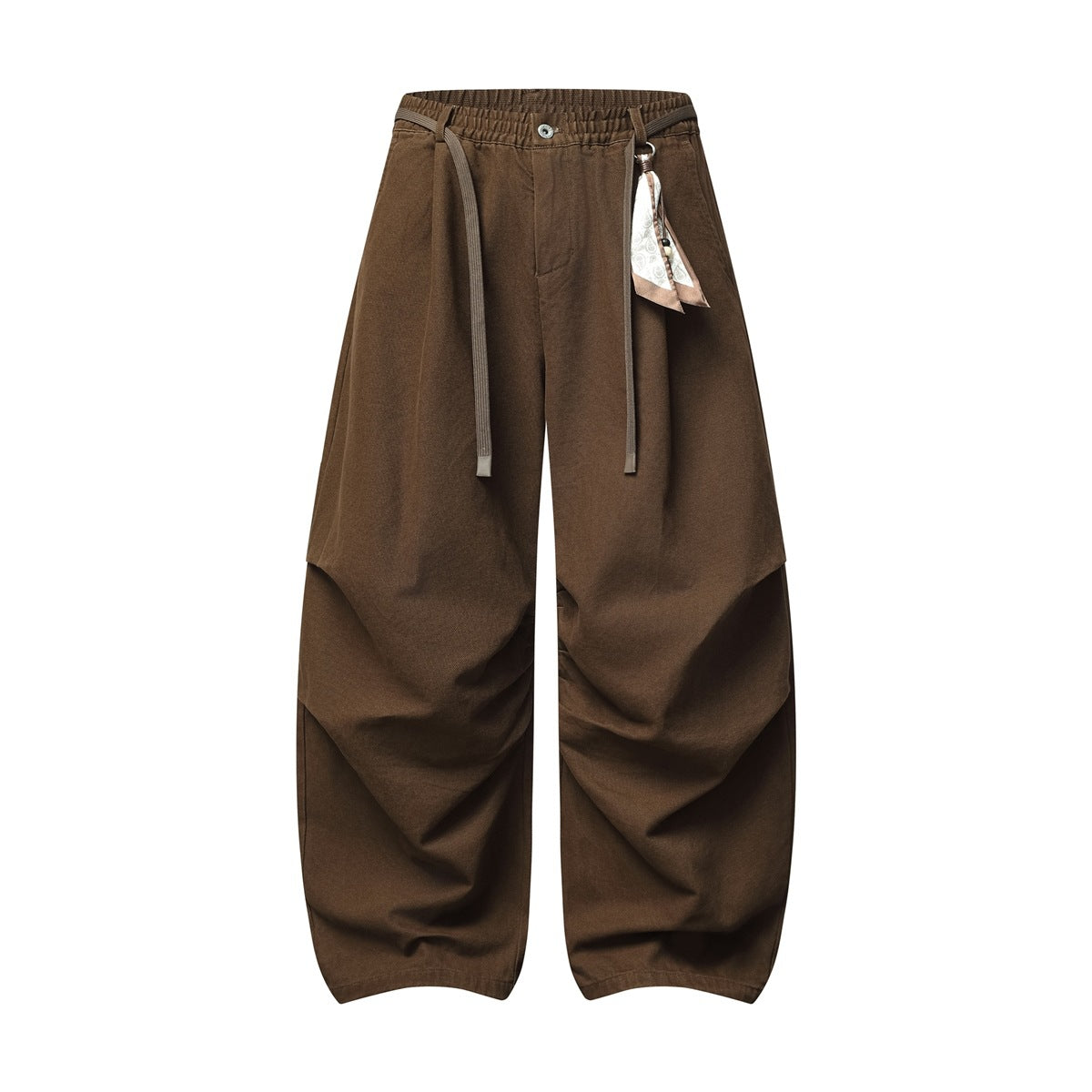 Brown wide-leg pants with elastic waist, drawstring tie, button front, knee pleats and a hanging scarf charm