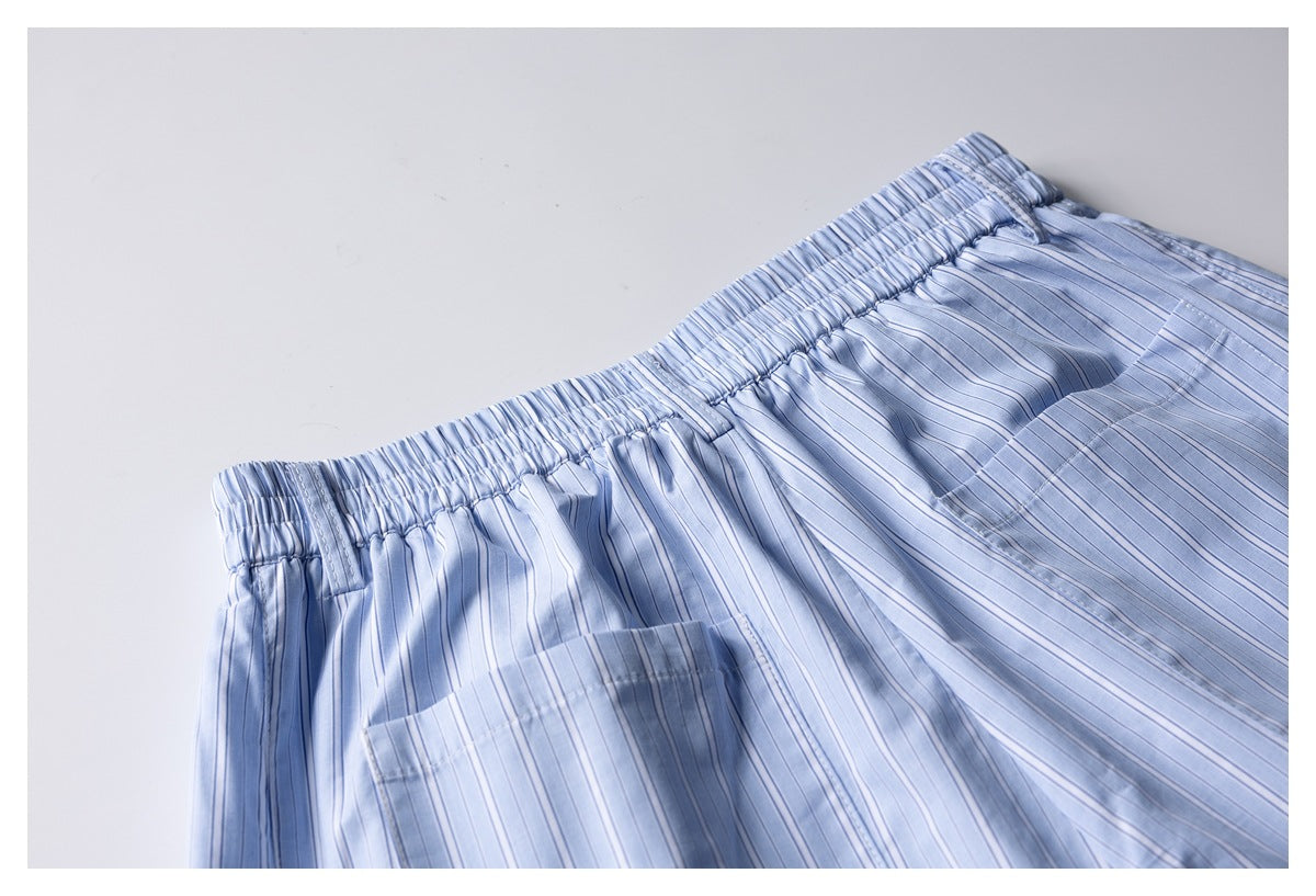 Close-up of the back of light blue striped shorts, showing the elastic waistband and a rear pocket.