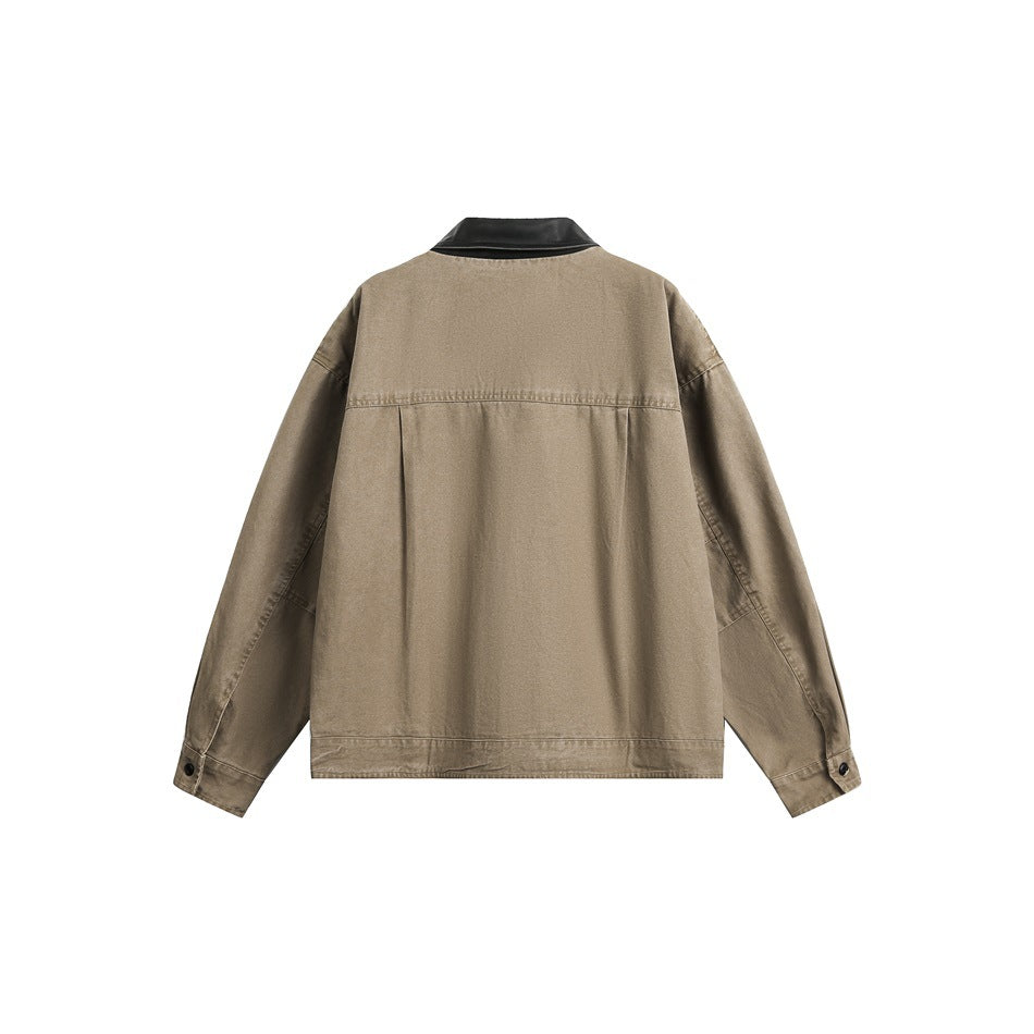 Back view of khaki jacket with black collar, yoke seam, center pleat and snap cuffs