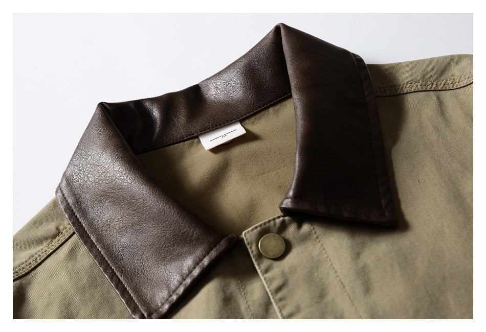 Close-up of an olive-khaki jacket with a dark brown collar and brass-tone snap.