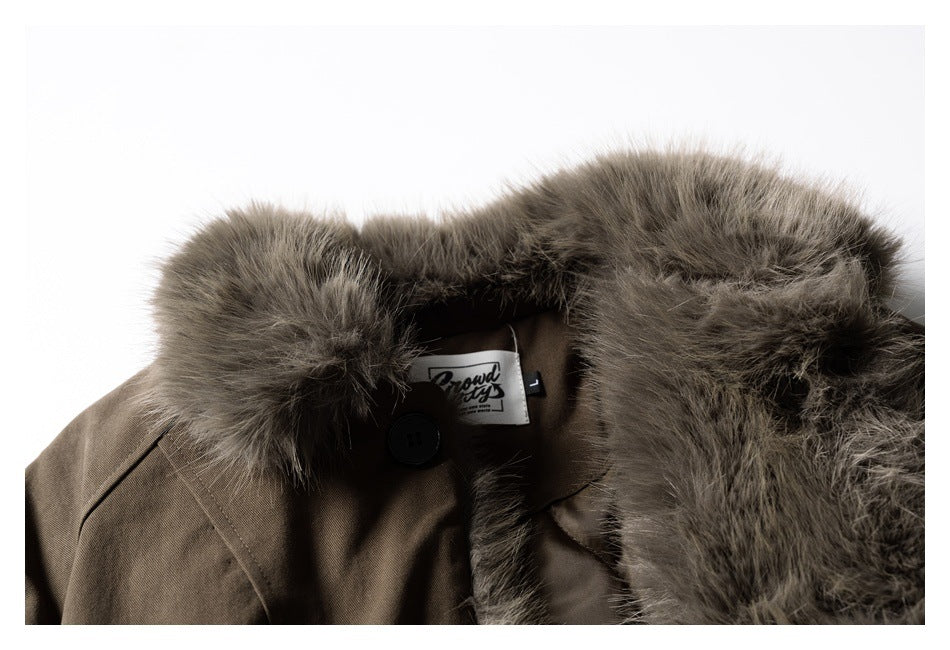 Close-up of the brown coat collar, thick gray-brown fur trim, button, and an interior brand label.