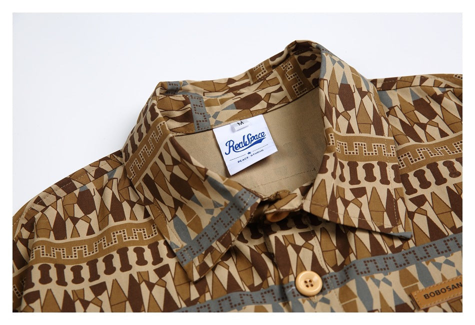Close-up of the brown geometric shirt collar, button, and sewn-in neck label.