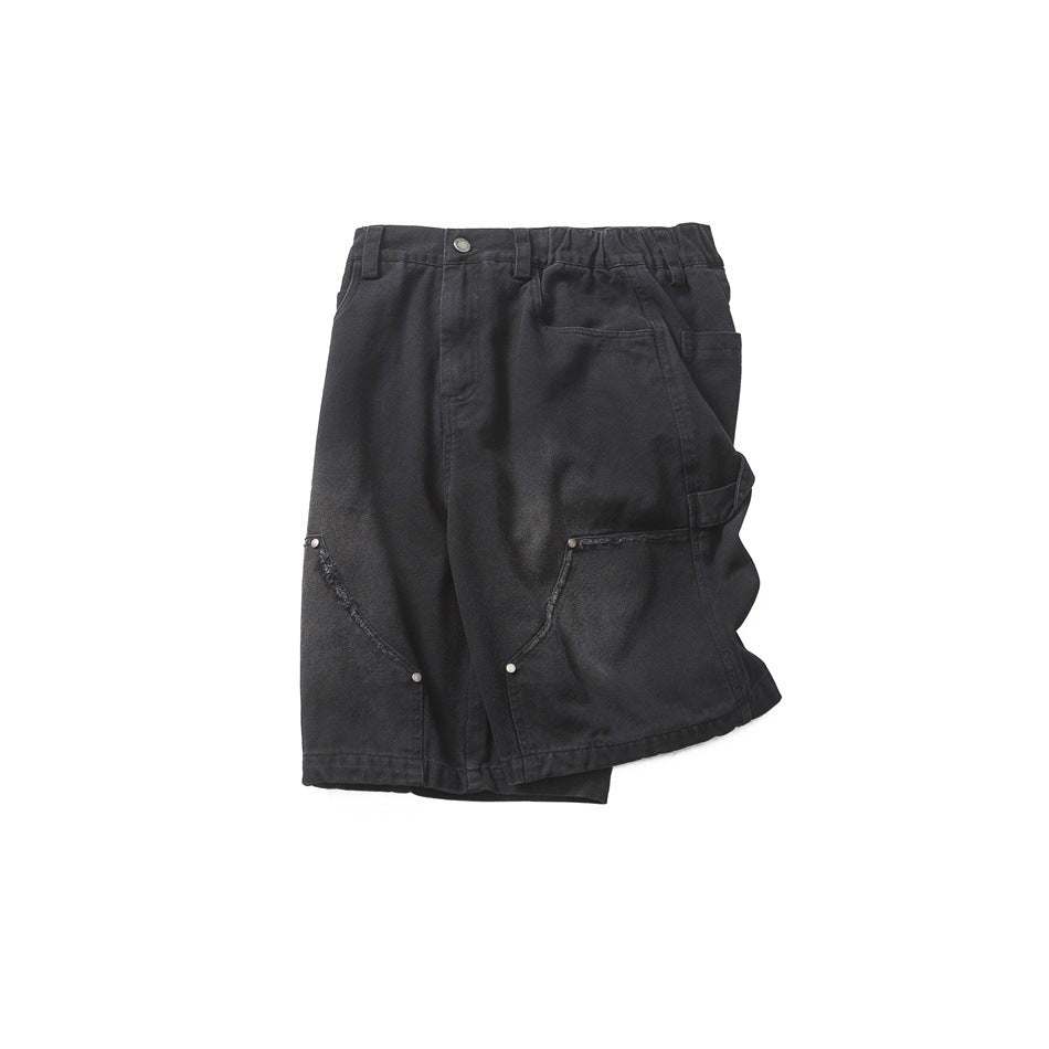 Front view of charcoal black shorts laid flat, with an elasticated waist, button closure and large curved-leg pockets.